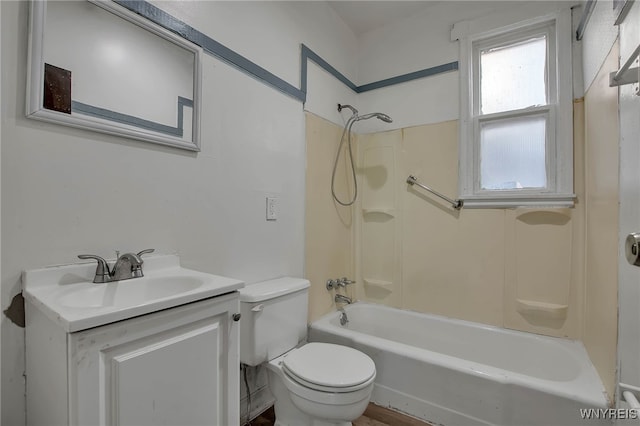 bathroom with vanity, shower / bathing tub combination, and toilet