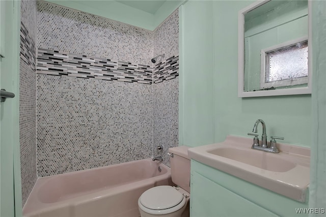 bathroom featuring vanity, toilet, and shower / bathing tub combination