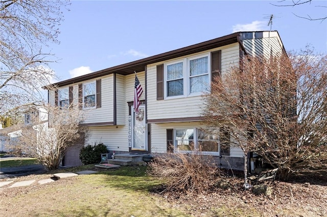 bi-level home with a front yard