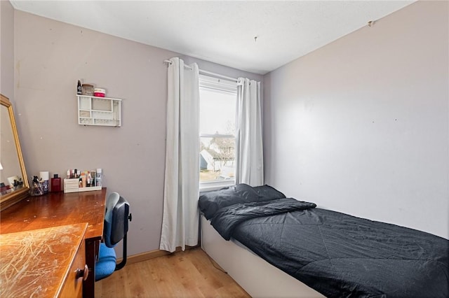 bedroom featuring light wood finished floors