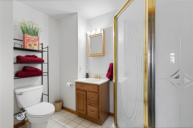 bathroom featuring tile patterned floors, toilet, vanity, and baseboards