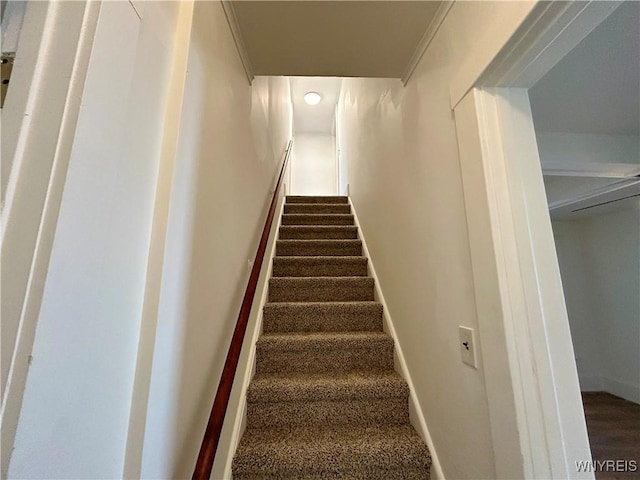 stairway featuring baseboards