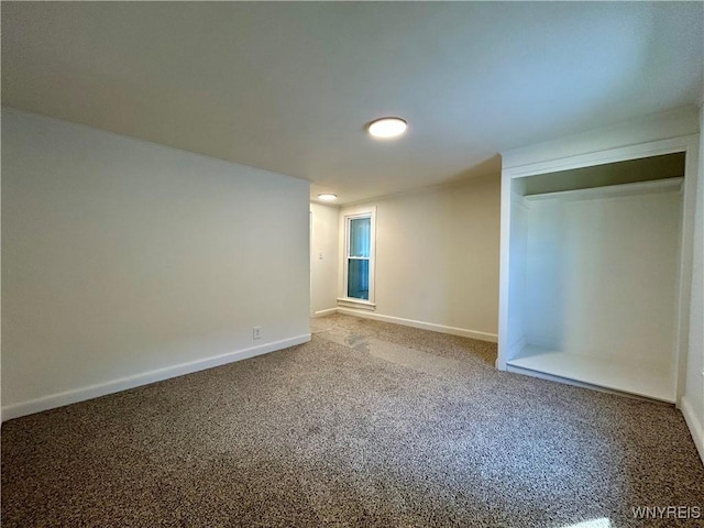 unfurnished bedroom featuring baseboards and carpet floors