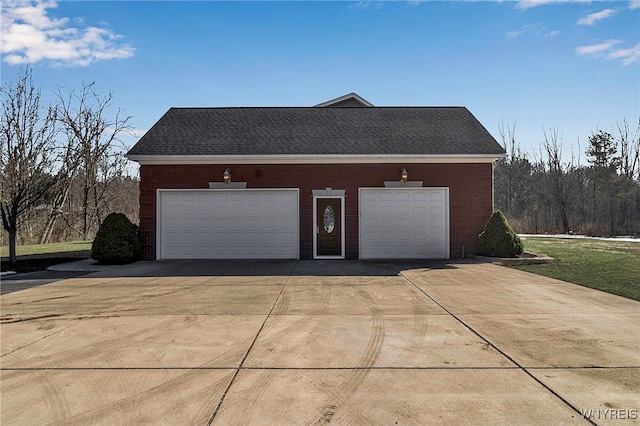 garage with concrete driveway