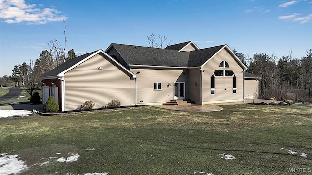 ranch-style home featuring entry steps and a front yard