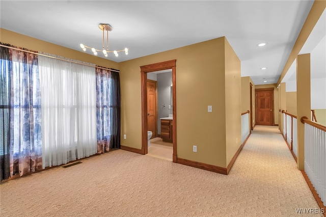 unfurnished room with recessed lighting, visible vents, a healthy amount of sunlight, and baseboards