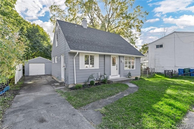 view of front of property featuring an outbuilding, a detached garage, concrete driveway, a shingled roof, and a chimney