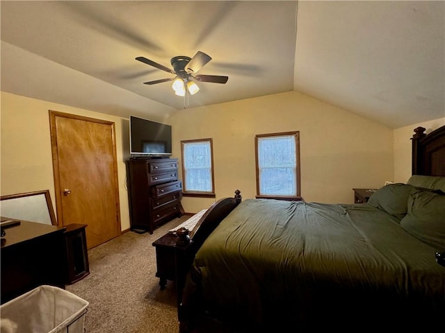 bedroom featuring a ceiling fan, lofted ceiling, and light colored carpet