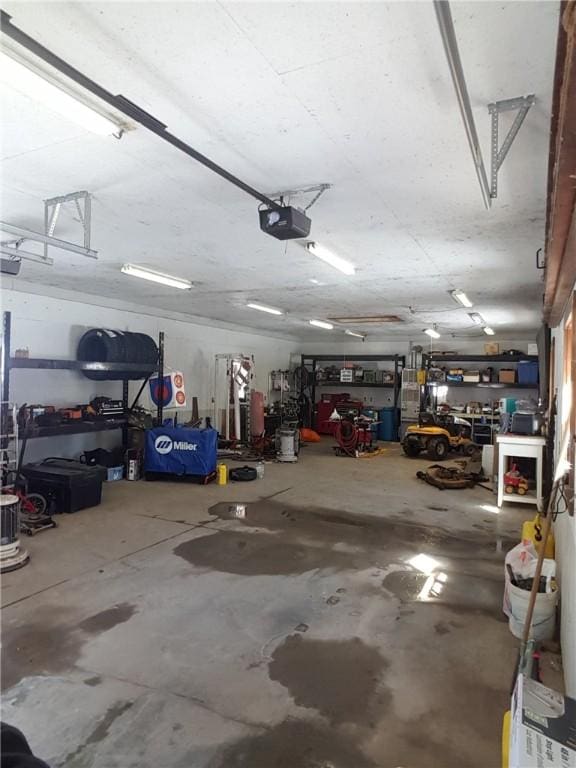 garage featuring a workshop area and a garage door opener