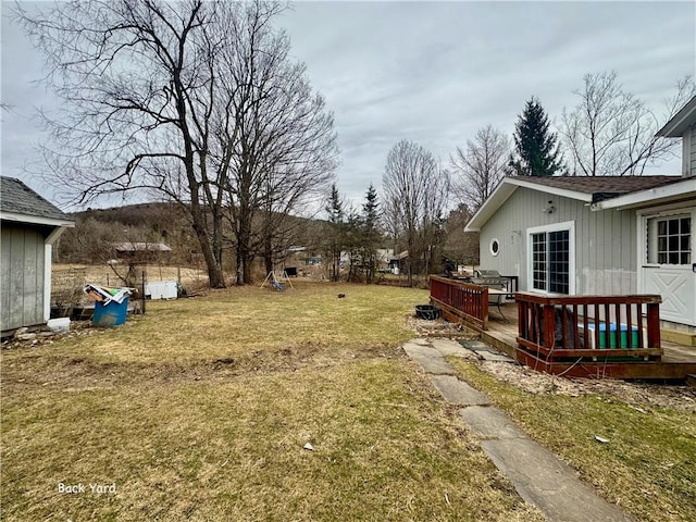 view of yard with a deck