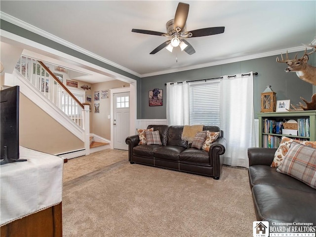 living room featuring ornamental molding, a ceiling fan, stairway, carpet floors, and baseboard heating