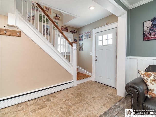 foyer featuring stairway, baseboard heating, and stone finish floor