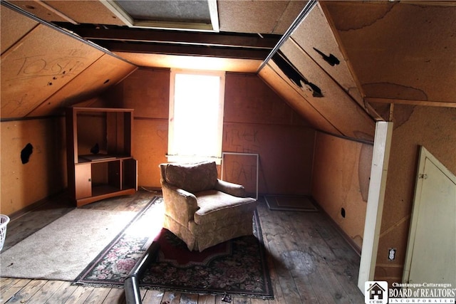 bonus room with lofted ceiling and hardwood / wood-style flooring