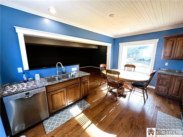 kitchen featuring baseboards, a sink, dark wood-type flooring, dishwasher, and crown molding