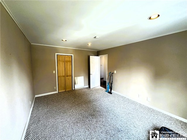 carpeted empty room with baseboards and ornamental molding