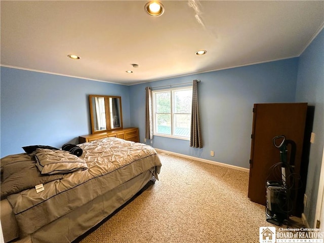 carpeted bedroom featuring recessed lighting, baseboards, and ornamental molding