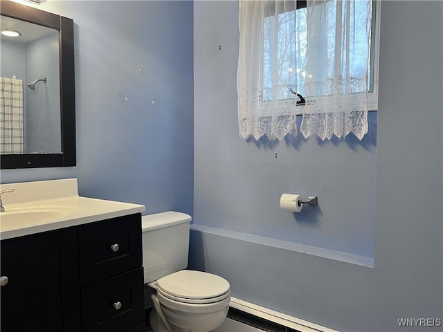 bathroom with toilet and vanity