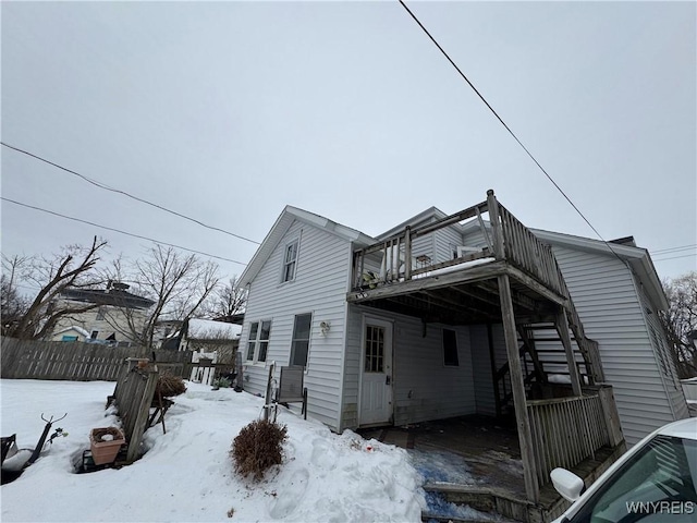 exterior space with a wooden deck and fence