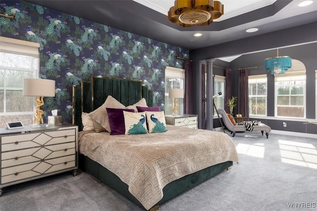 carpeted bedroom featuring recessed lighting, a tray ceiling, baseboards, and wallpapered walls