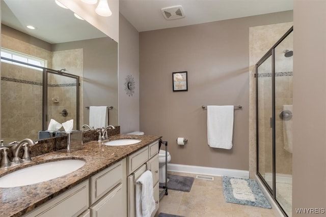 full bath with a stall shower, visible vents, and a sink