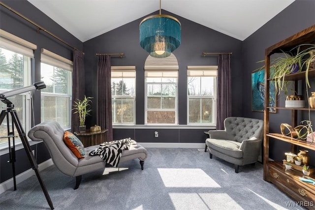 sitting room featuring carpet flooring, baseboards, and lofted ceiling