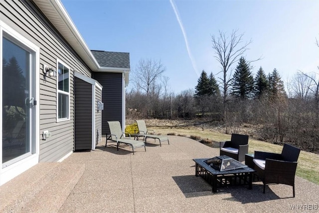 view of patio / terrace featuring a fire pit