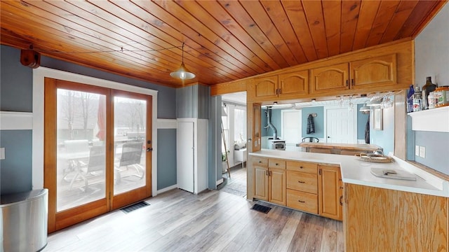 bathroom with wood ceiling, wood finished floors, and visible vents