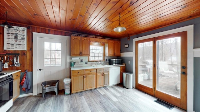 kitchen featuring wooden ceiling, white appliances, light wood-style floors, light countertops, and visible vents