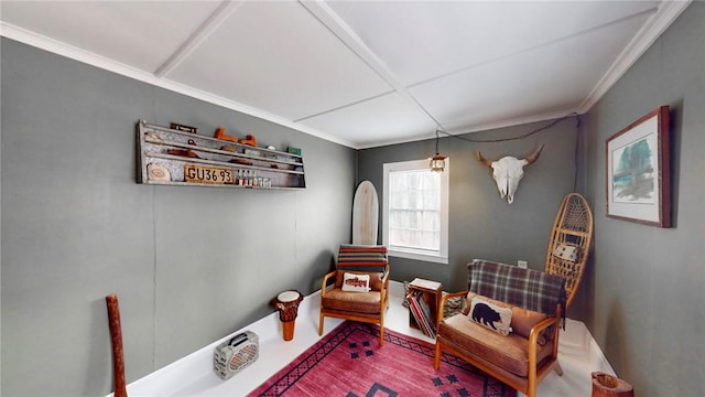 sitting room with ornamental molding