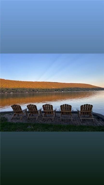 property view of water featuring a fire pit