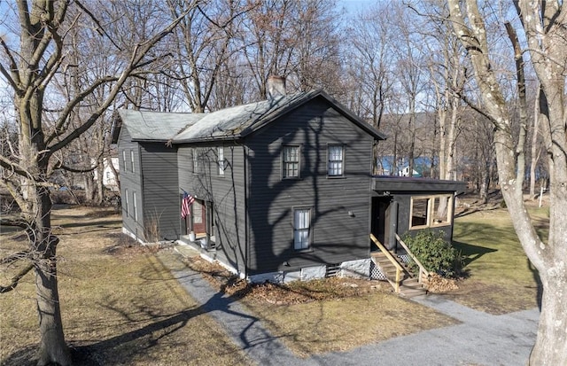 view of front of house with a chimney