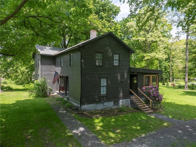 14838 W Lake Rd, Pulteney, NY 14418 - view of side of property with a chimney and a lawn