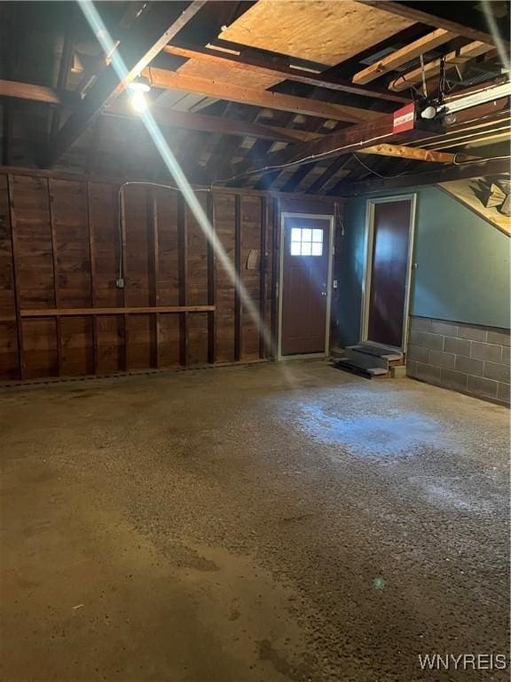 garage with concrete block wall