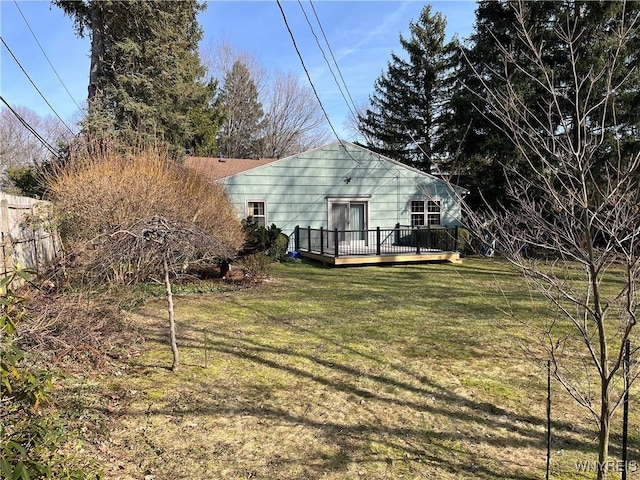 view of yard featuring a deck and fence