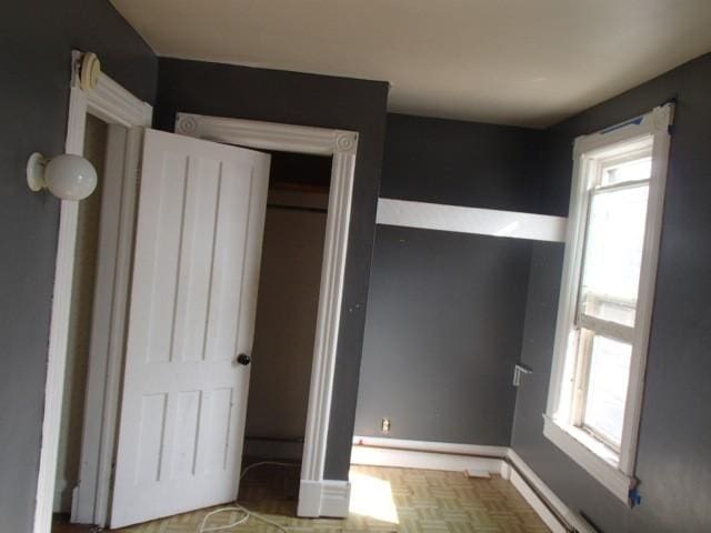 unfurnished bedroom featuring baseboards