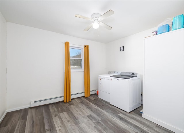 laundry room with a ceiling fan, washer and dryer, light wood-style floors, baseboards, and laundry area