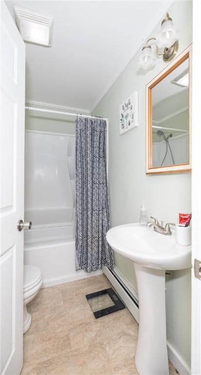 bathroom with toilet, visible vents, and shower / bath combo