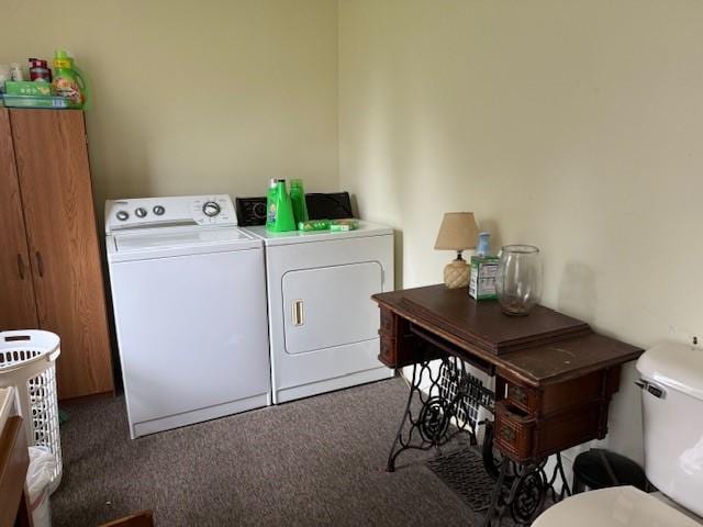 clothes washing area featuring washing machine and dryer and laundry area