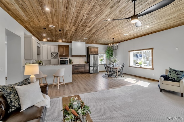 living room featuring recessed lighting, wood ceiling, ceiling fan, and light wood finished floors