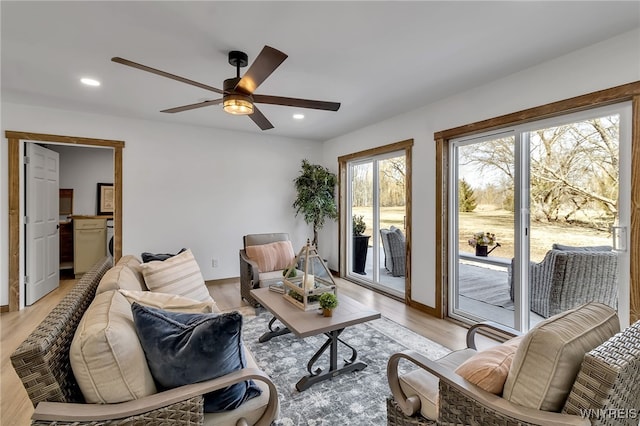 living area with recessed lighting, light wood finished floors, and ceiling fan