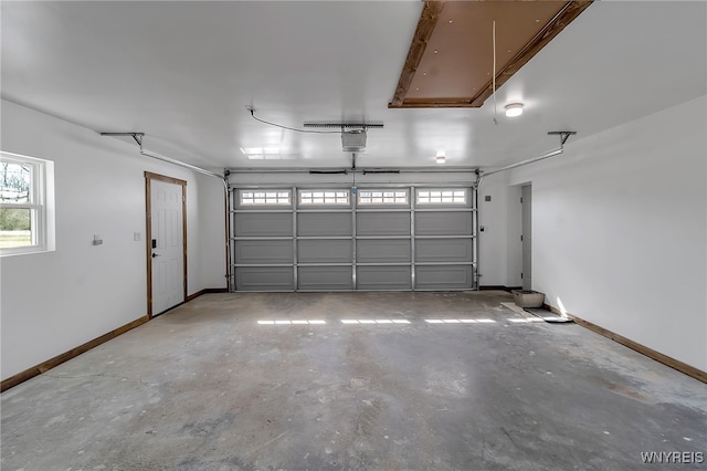 garage featuring baseboards and a garage door opener