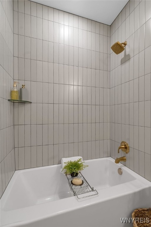 bathroom featuring tile walls and washtub / shower combination