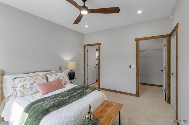 bedroom featuring recessed lighting, baseboards, light colored carpet, ceiling fan, and a spacious closet