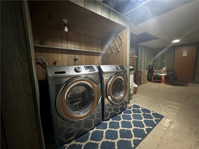 washroom with laundry area and washer and dryer