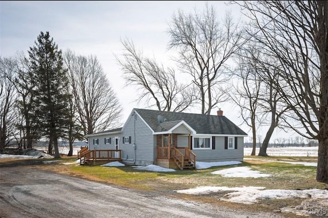 view of front of house with a chimney