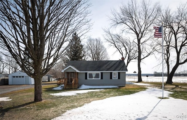 view of front of property with an outbuilding and a garage