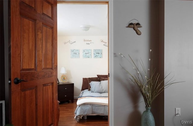 bedroom featuring wood finished floors