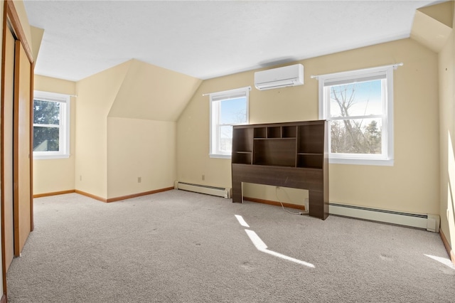 bonus room featuring vaulted ceiling, a wall mounted air conditioner, and a baseboard radiator