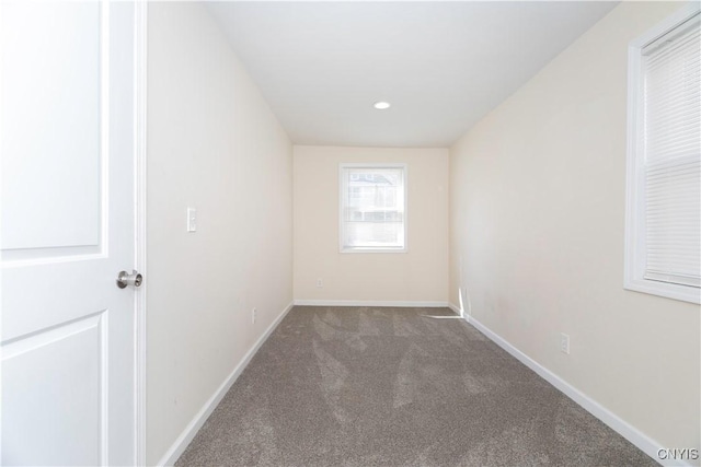 carpeted spare room featuring recessed lighting and baseboards