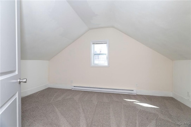 bonus room with a baseboard heating unit, lofted ceiling, baseboards, and carpet floors